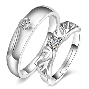 Elegant silver couple rings with adjustable wing design and sparkling crystal stones