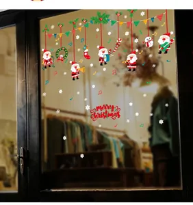 Detail of Merry Christmas window stickers with Santa, snowflakes, and festive music motifs