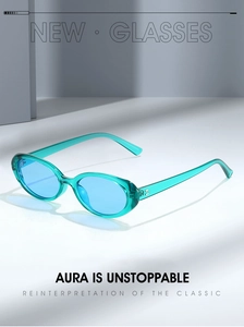 Detail view of oval turquoise sunglasses with light blue lenses and retro aesthetic