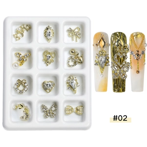 Boîte à 12 compartiments avec charmes d'ongles en alliage doré, nœuds et papillons