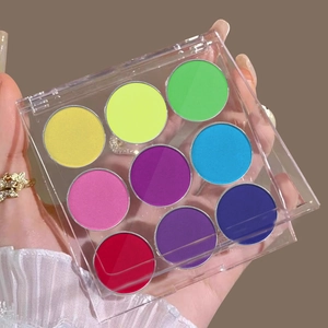 Macro shot of 9-color neon eyeshadow palette with vibrant pigments in acrylic case