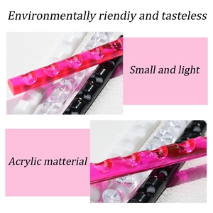 Macro view of transparent acrylic nail brush holder with smooth curved slots detail