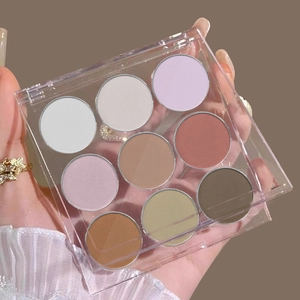 Detail view of a 9-color solid gradient nail powder palette in a clear acrylic case