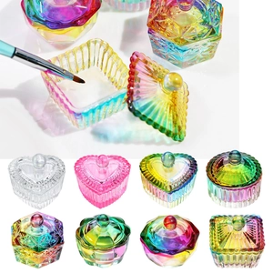 Close-up of heart and hexagon shaped aurora crystal nail art cups with lids
