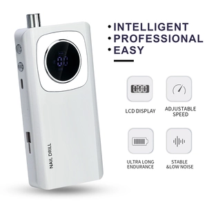 Detail of white electric nail drill with LCD screen showing 45000 RPM speed and battery