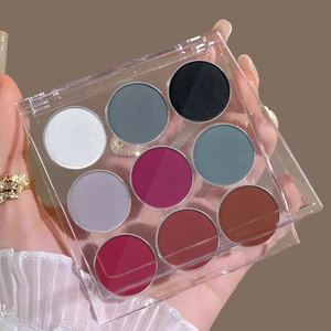 Detail of a nine-color solid nail powder palette with matte and shimmer gradient textures