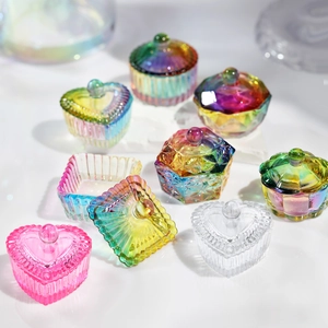 Iridescent glass nail art jars in heart, round, and hex shapes with faceted textures