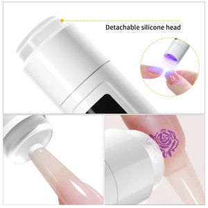 Portable handheld UV nail lamp with 360-degree rotating stand and silicone stamper