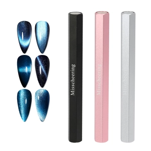 Dual-head cat eye nail magnet set showing blue magnetic polish effects on tips