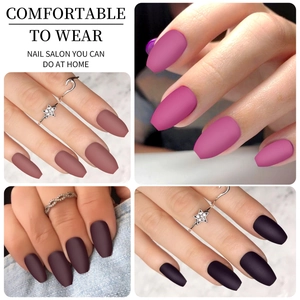 Detail of matte short coffin fake nails in nude, pink, purple, and burgundy colors