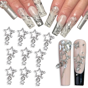 Detail of silver hollow star nail charms with dangling rhinestones for DIY manicure