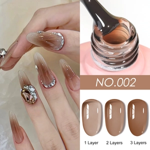 Macro detail of amber brown nail gel polish showing effects of 1 to 3 layers of application