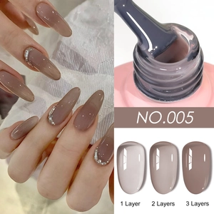 Detail showing layers 1 to 3 of nude mauve gel polish NO.005 on nails and brush