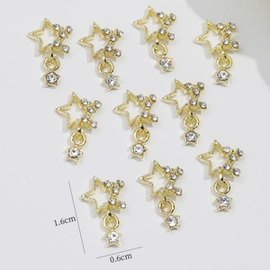 Macro view of 10pcs gold star nail charms with sparkling rhinestones and hollow design