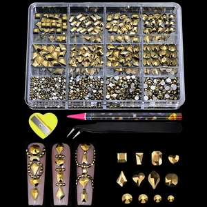 Detail of 12-grid nail art kit with gold crystals, tweezers, picker pen and sharpener