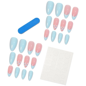 French almond press-on nails set with nude blue floral patterns and manicure tools