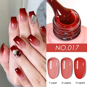 Deep red gel nail polish NO.017 showing 1 to 3 layers of opacity and rhinestone decor