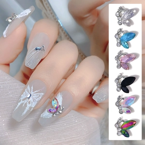 Detailed macro view of 3D crystal butterfly nail art charms in six vibrant colors