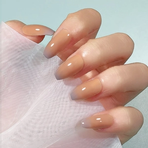 Nude to lavender ombre press-on nails in long coffin shape with glossy finish