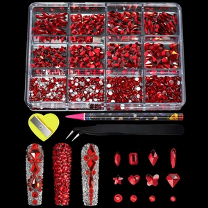 Detail of 12-grid red nail art rhinestone kit with tweezers, dotting pen, and flatback gems