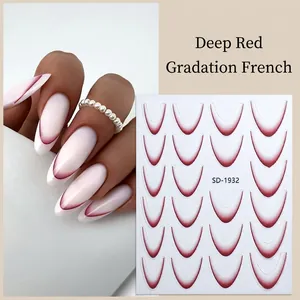 Macro detail of deep red gradient French nail stickers with U-shaped adhesive design