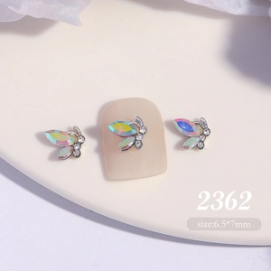 Detailed view of 6.5x7mm aurora crystal butterfly nail charms with alloy base