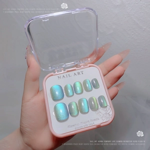Detail view of 10pcs aurora cat-eye press-on nails set in a pink storage box