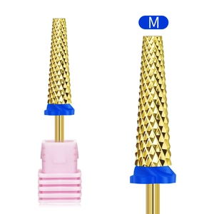 Macro shot of M-grit gold alloy cylindrical nail drill bit with cross-cut texture