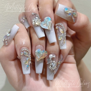 Long coffin pearl white press-on nails with iridescent heart rhinestones and butterfly design