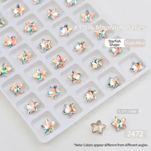 Macro view of Aurora K9 crystal star-shaped nail gems in 7.5mm silk moonlight finish