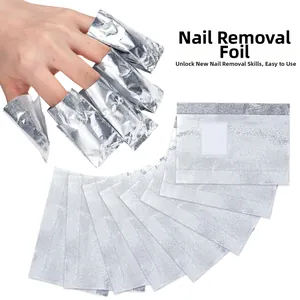 Macro shot of silver aluminum nail foil wraps with absorbent cotton pads for gel removal
