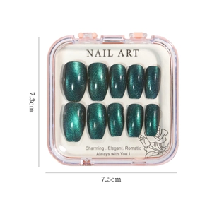 Press-on nail set with dark green cat-eye crystal effect in a clear display box