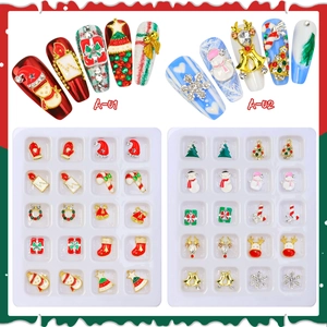 Christmas alloy nail art charms set with snowman and reindeer designs in a storage box