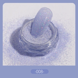 Macro shot of fine lavender sugar glitter powder for nails and a finished manicure tip