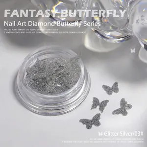Macro view of 03# sparkly silver 3D butterfly nail charms with glitter finish