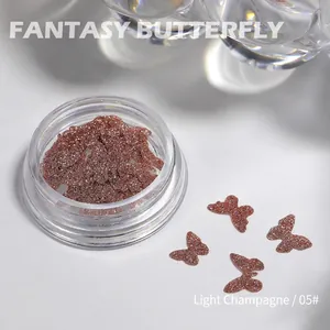 Detail view of champagne laser butterfly nail glitters in clear container