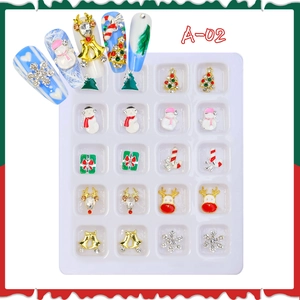 Macro view of Christmas alloy nail charms with rhinestones in 20-grid display case