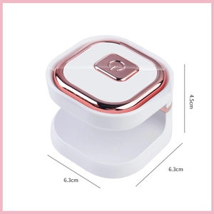 Detailed top view of a white and rose gold portable nail lamp showing dimensions 6.3x4.5cm
