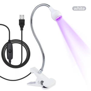 Detail of white mini UV nail lamp with flexible gooseneck, clamp and USB switch cable