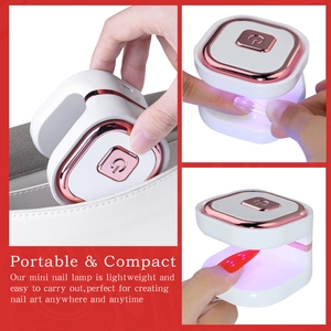 Portable mini UV LED nail lamp with white body and rose gold trim for home and travel