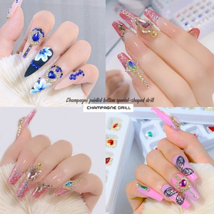 Mix of colorful nail art rhinestones with champagne crystals and floral nail charms