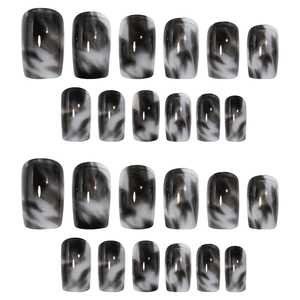 24-piece set of glossy black and white marble pattern press-on nails in various sizes