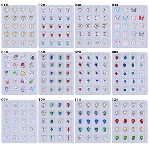 Assorted alloy nail art charms set with hearts, butterflies and crystals in 12 styles