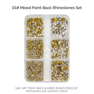 Close-up of gold and clear pointed back glass rhinestones in a 6-grid nail art box