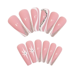 Pink coffin press-on nails with gold glitter tips, rhinestones, and star art designs