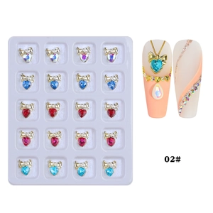 Detail of 20pcs nail art bow heart crystals in gold settings, mix of five colors