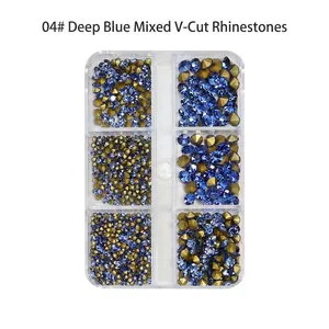 Detail of deep blue and gold pointed bottom nail crystals in a six-grid organizer box