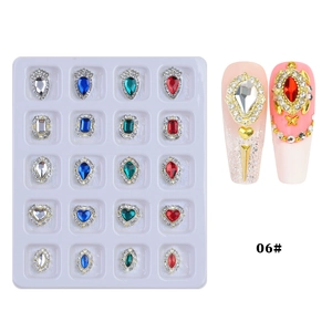 Detail view of heart and teardrop alloy nail rhinestones set with metal base