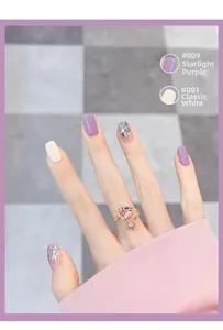 Detail view of purple heart ring paired with nail polish shades #009 and #001