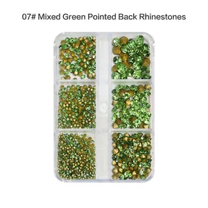 Detailed view of green pointed-back nail art rhinestones in a 6-compartment storage box